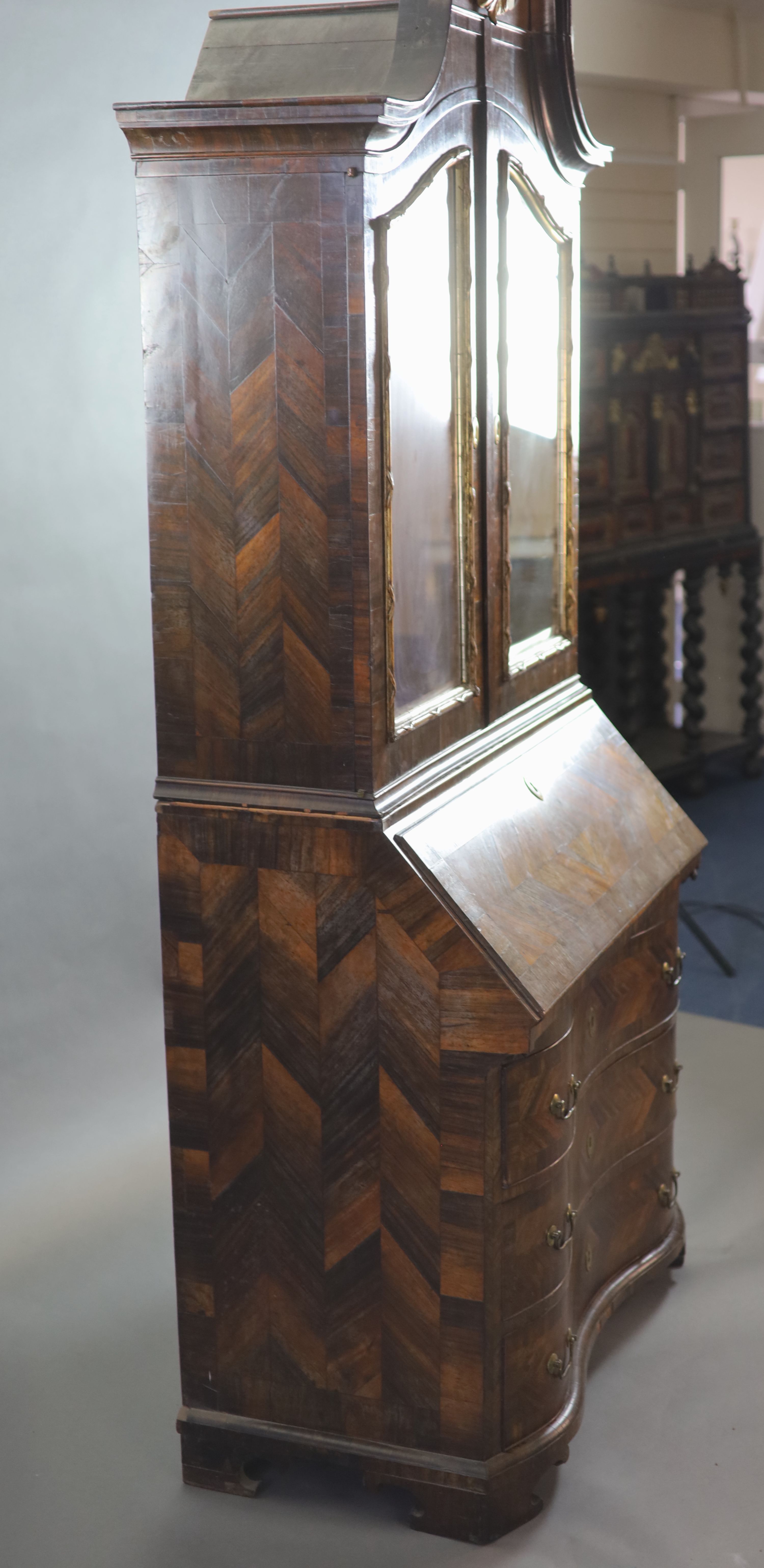 A mid 18th century Italian rosewood parquetry and parquetry bureau bookcase, W.107cm D.57cm H.237cm.